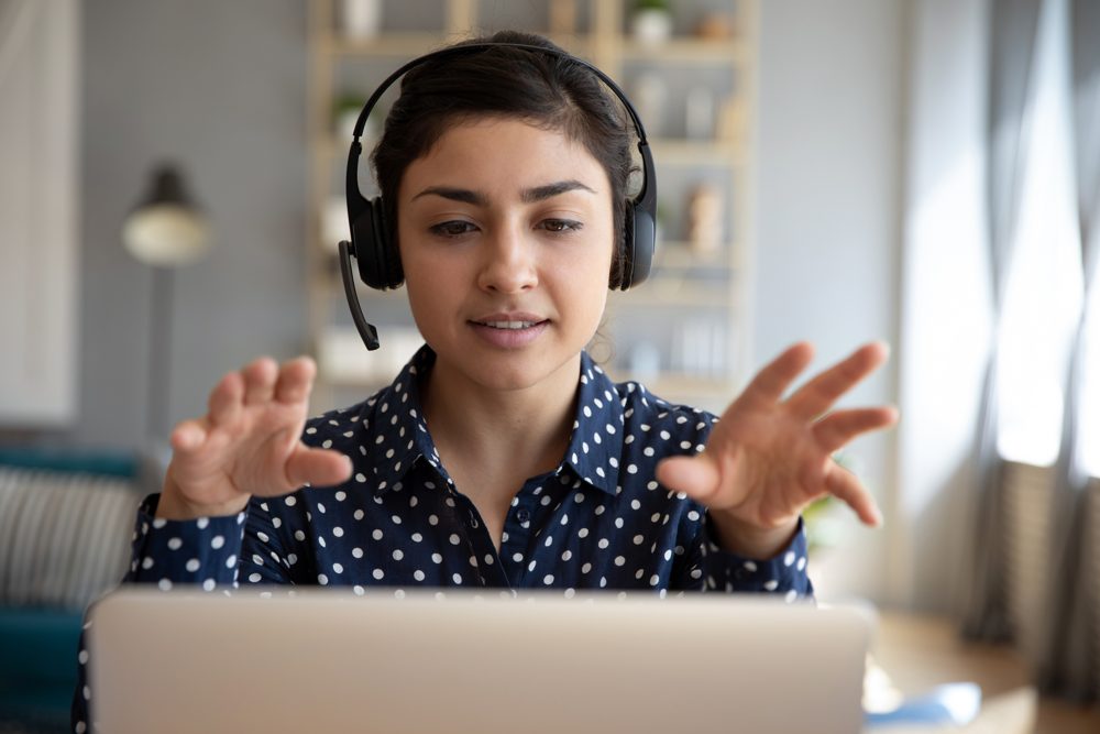 Interpreter with a headset providing remote interpretation on a video call